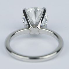 a close up view of a ring with a diamond on it's center stone