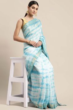 Product Features: Color: Blue Fabric: Pure Silk Type: Bhagalpuri Pattern: Tie and Dye Border: Zari Occasion: Festival Product Type: Saree Disclaimer: There will be slight difference in digital to actual image Blue Slub Silk Pre-draped Saree With Self Design, Blue Cotton Saree For Diwali, Blue Slub Silk Blouse Piece For Festivals, Blue Slub Silk Saree For Puja, Blue Slub Silk Traditional Wear For Puja, Blue Slub Silk Blouse Piece With Self Design, Blue Slub Silk Pre-draped Saree For Navratri, Blue Cotton Dupatta With Zari Weaving, Traditional Art Silk Saree For Summer