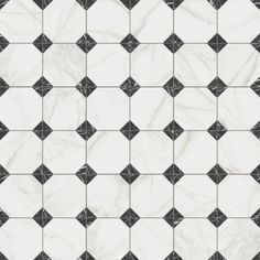 a black and white tile pattern with diamond shapes on it's sides, in the middle