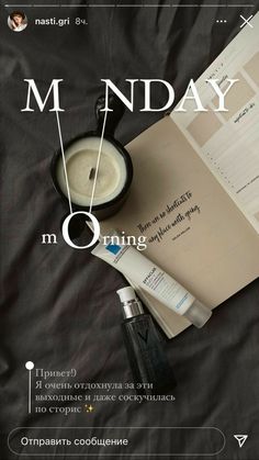 an open book with the words m nday on it next to a cup of milk