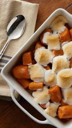 a casserole dish filled with marshmallows and carrots