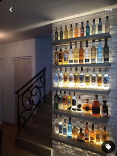 there are many bottles of alcohol on the wall