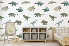 a child's room with dinosaurs on the wall