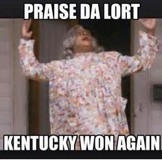 a woman standing in front of a door with her hands up and the words praise da lort kentucky won again