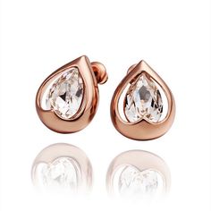 These uniquely shaped teardrop heart stud earrings are a romantic chic style. The dazzling pear shaped Austrian Crystal that centers the teardrop heart gives these earrings beautiful sparkle in a sophisticated setting. Great for every day with your jeans and tees, or dress them up for special occasions. Material: Your choice of yellow gold plated, rose gold plated, or white gold plated. Nickel free. Size: 15mm x 11mm Comes in a gift box. Romantic Chic Style, Pear Shape Earrings, Lucky Earrings, Stud Earrings For Women, Everlasting Love, Heart Studs, Heart Earrings Studs, Adjustable Ring, Heart Earrings