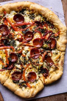 a pizza sitting on top of a wooden table