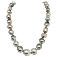 Fine Quality Hanadama Tahitian Pearl Necklace 14.3 mm Women 14k Gold Certified $9,750 917185 This is a Unique Custom Made Glamorous Piece of Jewelry! Nothing says, "I Love you” more than Diamonds and Pearls! This Tahitian pearl necklace has been Certified, Inspected, and Appraised by Gemological Appraisal Laboratory Gemological Appraisal Laboratory of America is a proud member of: - GIA Alumni Association - National Association of Jewelry Appraisers - International Consortium Gem-Testing Laborat Tahitian Black Pearl Necklace, Akoya Pearl Necklace, Diamonds And Pearls, Tahitian Pearl Necklace, Black Pearl Necklace, Gold Baroque, Pearl And Diamond Necklace, Alumni Association, Tahitian Black Pearls