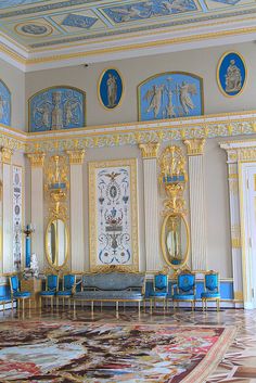 an ornate room with blue and gold furniture