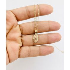 "❤️ 10k gold pendant Virgin Mary and necklace ❤️ Pendant is approximately 12mm ❤️ Dainty gold Figaro necklace 16\" or 18\" long 1.5mm ❤️ Virgin Mary white cubic zirconia ❤️ New fine jewelry ❤️ women Checkout my other jewelry ❤️ Dije y cadena colgante de oro de 10kilates ❤️ Virgen Maria de mujer de 12 milímetros ❤️ Virgen de Guadalupe delgadita mide 16 o 18 pulgadas de larga ❤️ Oro dorado con piedra blanca zirconia ❤️ Incluye cajita SKU 31542" Gold Teardrop Diamond Cut Solitaire Necklace, Gold Solitaire Teardrop Necklace With Diamond Cut, Gold Oval Solitaire Necklace With Diamond Cut, Gold Solitaire Cubic Zirconia Gemstone Necklace, Figaro Necklace, Turquoise Charm, Hand Necklace, Dainty Gold Necklace, Pearl Gemstone