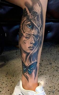 a woman's leg with an owl and butterfly tattoo on the side of her leg