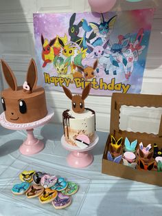 pokemon themed birthday party with cake, cupcakes and other items on the table