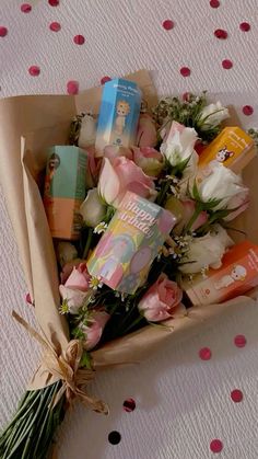 a bouquet of flowers sitting on top of a table next to a package of baby's breath lotion