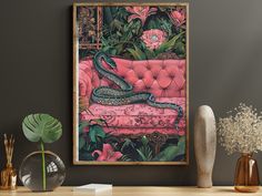 a snake is sitting on a pink couch in the middle of a room with flowers and plants