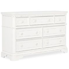 a white dresser with six drawers and two pulls on the bottom drawer, in front of a white background