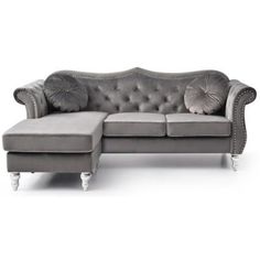 a gray couch with two pillows on it