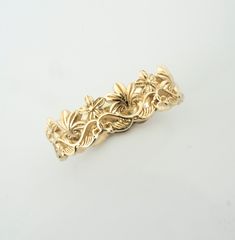 This is a completely original floral design, vintage style ring inspired by tropical palms and flowers. With its intricate details, it is also reminiscent of a crown fit for a fantasy princess. Handmade and polished, it is available 8K or 14K gold and has a uniquely vintage - yet magical look about it. This ring is designed in 3D and not made out of wire or soldered but cast directly in your size so there are no solder marks on the ring whatsoever. Customization: This band is fully customizable Yellow Gold Flower Ring With Intricate Design For Wedding, Bohemian Engraved Wedding Ring With Intricate Design, Heirloom Flower Ring With Intricate Design For Wedding, Flower Shaped Wedding Rings With Intricate Design, Vintage Flower Ring With Intricate Design For Wedding, Adjustable Intricate Design Flower Ring For Wedding, Crown Gold Ring, Ring Crown, Botanical Vintage