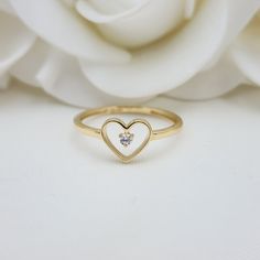 Our Adorable solid Gold Heart Solitaire CZ ring is crafted in Solid 14k Gold which makes it perfect to wear everyday and in every occasion.this ring is simple yet perfect. Unique, elegant and everlasting. 14k Gold will not tarnish or rust. Materials: 14k Gold, CZ Diamonds Stone size: 2mm Heart size: 8x7mm Band width: 1.5mm Weight: 1.3 grams 14k stamped  Brand new Follow us in our social media for more solid 14k Gold Jewelry. Please. Do not hesitate to contact me i will be happy to answer all you White Gold Heart Ring With Single Diamond For Gift, 14k Gold Heart Ring With Single Diamond For Gift, 14k Gold Heart Ring With Single Diamond For Promise, Everyday Yellow Gold Heart Ring With Charm, Heart-shaped Single Diamond Jewelry For Promise, Heart-shaped Single Diamond Promise Ring, Delicate Heart Charm Ring As Gift, Everyday 14k Gold Heart Stackable Rings, Stackable Heart Ring For Everyday And Valentine's Day