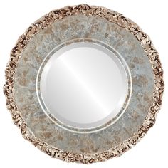 a round mirror sitting on top of a white wall