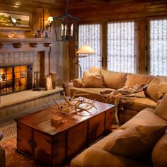 a living room filled with furniture and a fire place