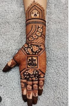 a henna design on the palm of someone's hand