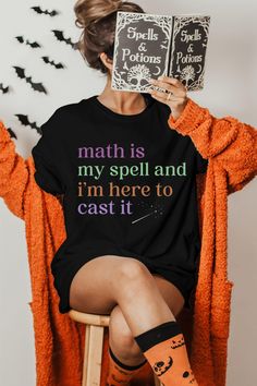 Are you looking for a Halloween shirt for a math teacher? This funny tshirt, with a witch themed design, is meant to bring a smile on any math teacher's face every time they will wear this tee and to remind them how proud they are of the subject they teach. If you know a math teacher who loves wearing clothes that represent their beloved profession, this shirt would be the perfect gift for them. Check out more unique and funny designs in our shop, including more teacher gifts: https://www.etsy.c Funny Witch, Math Teacher Shirts, Halloween Math, Create Picture, Funny Tshirt, Math Teacher, Appreciation Gifts, Wearing Clothes, Teacher Appreciation Gifts