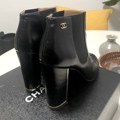 Beautiful Chanel Calfskin Booties In Black Size 37.5 A Few Scratches But Great Condition. Only Worn A Few Times. Purchased For $1,100 + Tax At Neiman Marcus (See Pic)