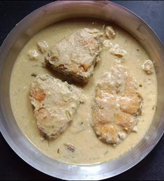 three pieces of meat in a creamy sauce