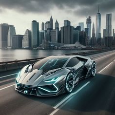 a silver sports car driving down the road in front of a large cityscape