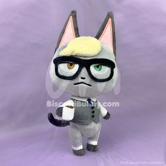 a plush toy cat with glasses and a tie on it's head, standing in front of a purple background