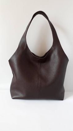 "This hand bag is crafted from textured soft leather in brown . It's the ideal size for taking you from desk to dinner, and can be worn over the shoulder for hands-free. - Two shoulder straps. - Pleated top with magnetic fastening. - You can choose from 8 leather colors. - Cotton lining with zip close compartment for securing your necessities, you can choose from 7 different linings. Free delivery is economic delivery. We use Latvian post and delivery can take 1-3 weeks in the EU, 3-4 weeks ever Brown Leather Hobo Bag With Rolled Handles, Brown Textured Leather Hobo Bag With Double Handles, Leather Hobo Bag With Rolled Handles, Brown Textured Leather Hobo Tote Bag, Brown Double Handle Hobo Bag With Rolled Handles, Brown Satchel Bucket Bag With Rolled Handles, Brown Leather Bucket Bag With Rolled Handles, Brown Satchel With Rolled Handles, Brown Hobo Bag With Rolled Handles For Daily Use