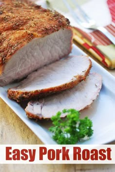 pork roast on a plate with parsley sprig and broccoli next to it