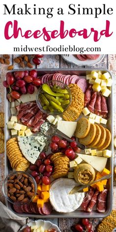 an assortment of cheeses, crackers, and meats on a platter