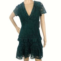 Nwt Lulus Party Cocktail Formal Dress Size M Emerald Green Lace Short Sleeve Ruffle Layered Tiered V-Neck Mini A-Line Evening Dress - Excellent Condition! (No Rips, Stains Or Tears.) - Women's Size Medium - Measurements: Bust 32-37" / Waist 28-30" / Length 34" - Material: Polyester (7) V-neck Ruffled Lace Dress For Party, Evening V-neck Lace Dress With Ruffles, Green Short Sleeve Lace Dress For Party, Evening Lace V-neck Dress With Ruffles, Green Tiered Mini Dress For Party, Green Short Sleeve V-neck Dress For Party, Lace Mini Dress With Ruffles And V-neck, Elegant Green Mini Dress With Lace Trim, Elegant Green Tiered Mini Dress