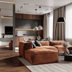 a living room filled with furniture and a flat screen tv mounted to the side of a wall