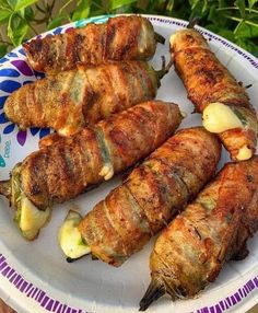 several skewers of food are on a plate