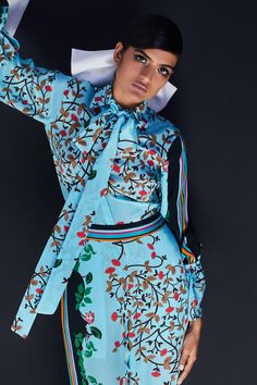 Turquoise blue shirt with bow tie-up neck and all-over floral printed motifs.
Component: 1
Printed
Neckline: Spread Collar
Sleeve Length: Full
Fabric:  Crepe
Color: Blue

Bow tie-up neck
Note: Pant worn by the model is not for sale - Aza Fashions Floral Print Shirt Women, Print Shirts Women, Blue Bow Tie, Pant Suits, Floral Print Shirt, Blue Bow, Shirt For Women, Online Tops, Print Shirt