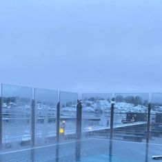 an empty swimming pool in the middle of winter