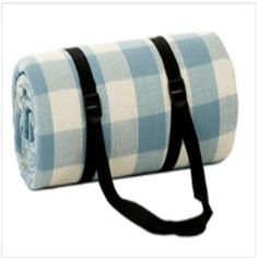 a blue and white checkered blanket with black straps on the bottom, rolled up