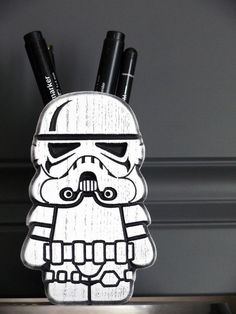 a star wars themed pen holder with two pens in the shape of stormtrooper