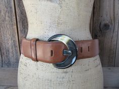 "90s caramel brown leather waist belt with chunky resin buckle. All leather, through and through. Made for CIPRIANI.  Label size M Holes at 28 to 32\" mark, measured from prong to first and last holes Width is 2\" Good vintage condition with some scuffs here and there and some subtle darkening of leather. Some scuffs also to buckle." Retro Brown Belt Buckle With Antique Design, Thrift Manifestation, Leather Waist Belt, Caramel Brown, Brown Leather Belt, Brown Belt, Suspender Belt, One Star, Buckle Belt