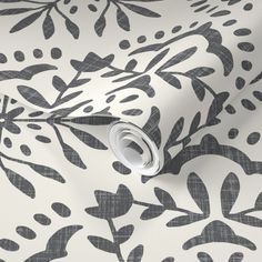 black and white wallpaper with leaves on it