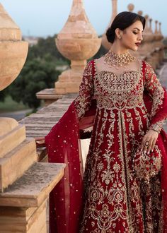 Red Pakistani Bridal Dress in Lehenga and Pishwas Style is a heavily embellished masterpiece adorned with silver goldwork. Premium quality fabric, zardosi, tilla, stones, and dabka make this beautiful Pishwas Dress an epitome of beauty and grace. Pakistani Bridal Pishwas: Pakistani Bridal Pishwas in an alluring red color has open style is gracefully emblazoned with zardosi, dabka, tilla, sequins, and crystals. The Traditional Pishwas in organza fabric is embellished with intricate designs and goldwork, making this attire your priority for the big day. The stylish sweetheart front neckline and backless design with embellished straps give a perfect finishing to this Red Pishwas Dress. Red Lehenga: The Bridal Lehenga has premium quality raw silk fabric and it looks perfect when paired with th Floor-length Lehenga With Mirror Work For Traditional Ceremonies, Traditional Mirror Work Lehenga For Ceremonies, Floor-length Mirror Work Lehenga For Traditional Ceremonies, Traditional Mirror Work Floor-length Lehenga, Anarkali Kundan Gown For Traditional Ceremonies, Anarkali Gown With Mirror Work For Traditional Ceremonies, Floor-length Dupatta With Mirror Work For Traditional Ceremonies, Festive Kundan Gown For Traditional Ceremonies, Floor-length Mirror Work Dupatta For Traditional Ceremonies