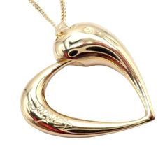 About This Piece: Experience the allure of infinity with this Rare Georg Jensen 18K Yellow Gold Diamond Snake Eating Tail Ouroboros Necklace. The centerpiece is an intricate, diamond-eyed snake biting its own tail, a powerful representation of the Ouroboros – the ancient symbol of eternity. Crafted with unparalleled skill, this necklace blends the warmth of yellow gold with the sparkle of the diamond. This Georg Jensen creation is more than just jewelry; it's a conversation-starting piece that embodies timeless elegance and philosophical depth. Metal: 18k Yellow Gold Pendant Size: 24.5mm x 25mm Chain Length: 18" Weight: 17.5g Hallmarks: Georg Jensen 750 Denmark Georg Jensen Jewelry, Snake Bites, Georg Jensen, Ancient Symbols, Yellow Gold Pendants, Buying Jewelry, Chain Lengths, Gold Pendant, Gold Diamond