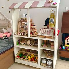 a child's play room with toys on the shelves