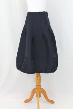 "Vintage Trelise Cooper Black Bubble Skirt This skirt is in mint condition Hidden side zipper, unlined, elastic hem Black silk full skirt with  an elastic bubble hem Very famous New Zealand designer Size tag is missing but measures to: USA Size 10 GB 12 France size 40 Japan size 15 Germany 38 Italy 44 Measures: Waist 30\" Hips: 46\" length 26\"" Black Bubble Skirt, Cooper Black, Trelise Cooper, Bubble Hem, Sailor Collar, Bubble Skirt, Super Cute Dresses, Dropwaist Dress, Drop Waist