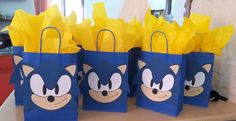 sonic the hedgehog paper bags are on a table