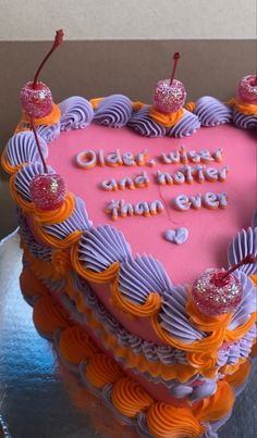 a heart shaped cake with the words old west and better than ever written on it