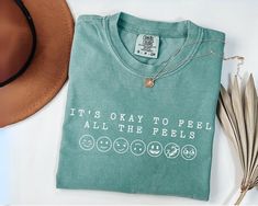 a t - shirt that says it's okay to feel all the feels