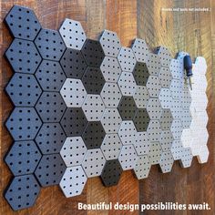 several hexagonal tiles are arranged on a wooden surface with the words beautiful design possibilities await