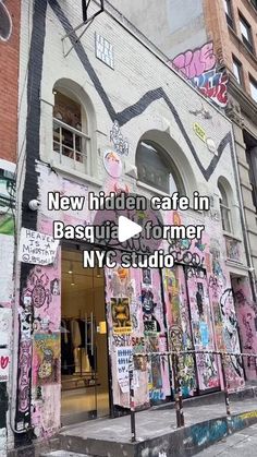 a building with graffiti all over it and the words new hidden cafe in basquia former ny studio